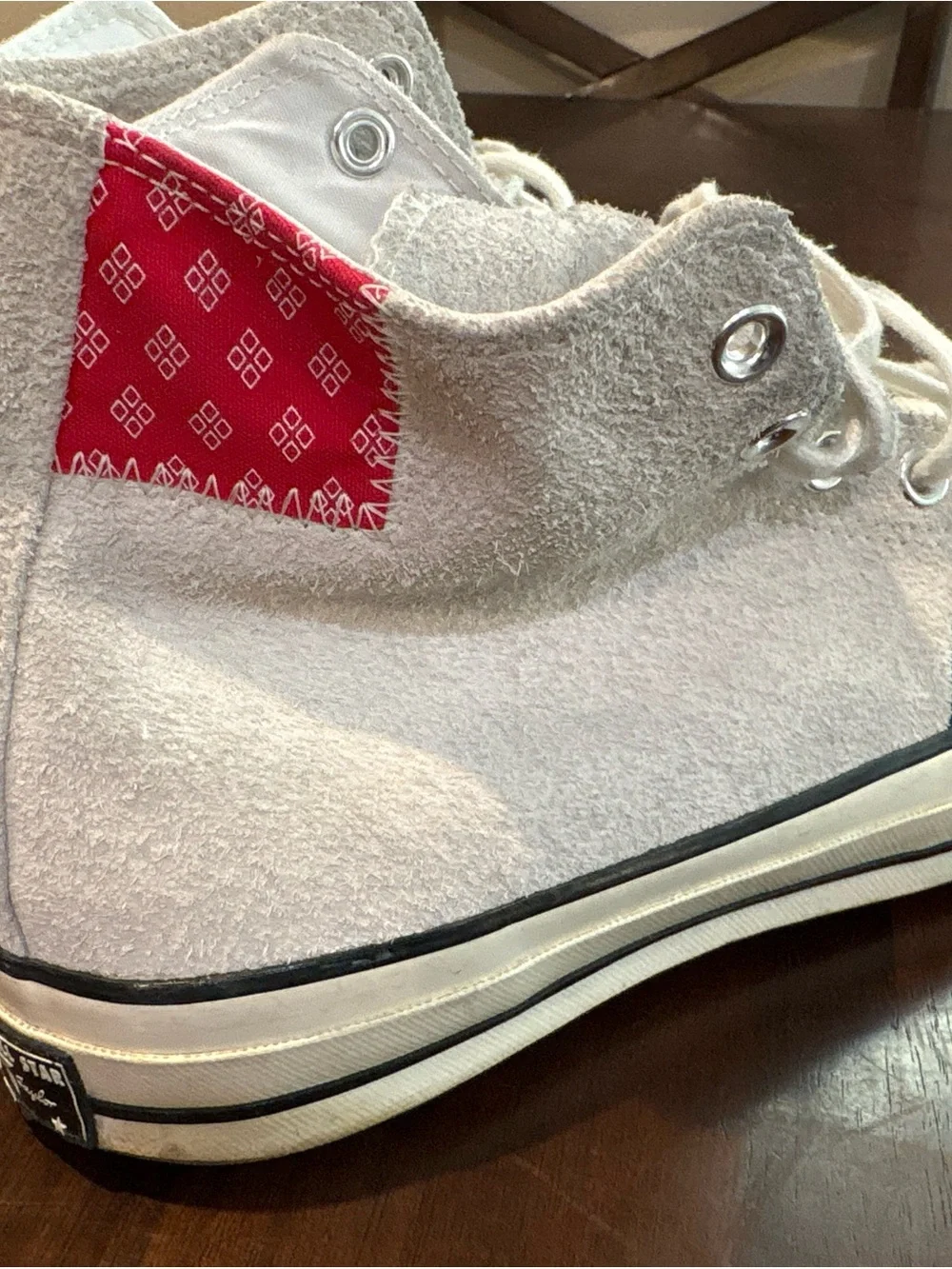 Converse Chuck Taylor’s White High Top Sneakers with Red and Blue Accents